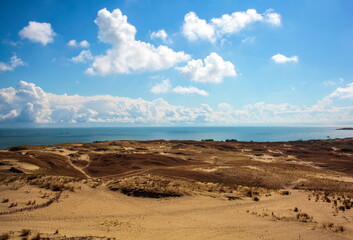 Sand dunes and clouds