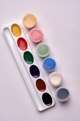 watercolor paint and gouache paints on a white background