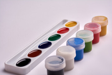 watercolor paint and gouache paints on a white background