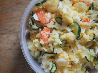 Japanese style potato salad with boiled egg, pickled cucumber, onion and carrot
