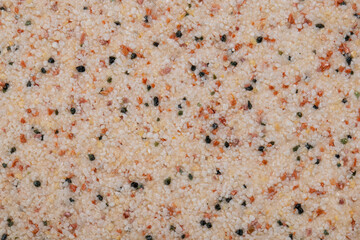 textural plaster of the house wall, colored granite chips, background