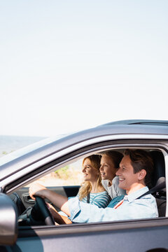 Selective Focus Of Family Traveling In Car During Weekend