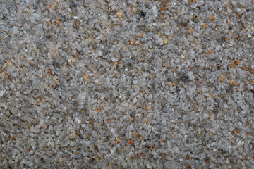 textural plaster of the house wall, colored granite chips, background