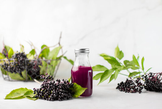 Elderberry syrup in a bottle, front view