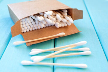 Cotton buds are scattered. Eco-friendly hygiene product