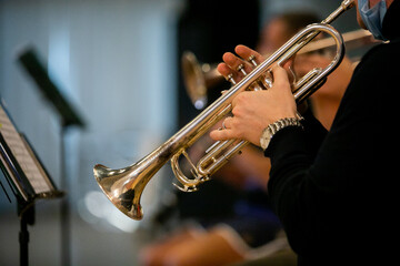 Obraz na płótnie Canvas Trumpet instrument. Music player trumpeter jazz playing. Brass instrument cornet hands