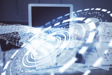 Double exposure of laptop computer and technology theme hologram. Concept of freelance work.