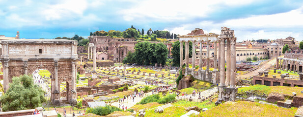 Panoramic view, aerial skyline of  Roman Forum with ancient ruins of temple, columns of Saturn,...
