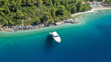 Obraz premium Aerial drone photo of luxury yacht anchored in tropical exotic island bay with turquoise sea