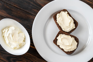 Slices of rye bread with cream cheese