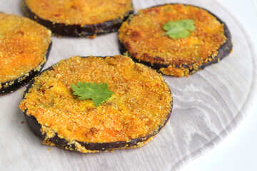 Indian side dish or appetizer  Vangyache Kaap, fried Eggplants, Crispy brinjal fry, Aubergine disks, served with tomato ketchup. With copy space