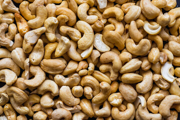 close up of roasted cashew nuts - background