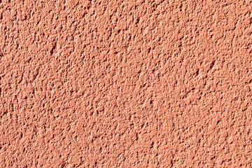 background of red colored plaster wall
