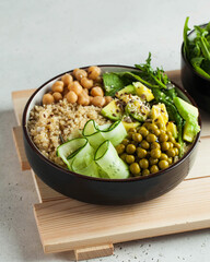 Healthy vegetable lunch from the Buddha bowl with quinoa, avocado, chickpeas. healthy food dish for vegetarians.