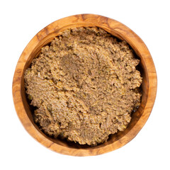 Tapenade - olive paste made from green olives. Spreadable green olive cream in wooden bowl isolated on white. Top view.