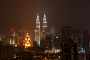 Fototapeta na wymiar Top view of Petronas towers skyline at twilight, night time. Travel Malaysia, Luala Lmpur city centre