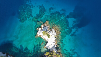 Fototapeta na wymiar Aerial drone photo of tropical exotic bay with turquoise rocky seascape in Caribbean destination island