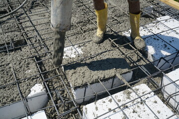 Pouring concrete construction, worker working in concrete casting