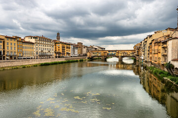 Fototapeta premium Florence cityscape with the Ponte Vecchio (Old Bridge) and the River Arno, view from the bridge of Santa Trinita. Tuscany Italy, Europe