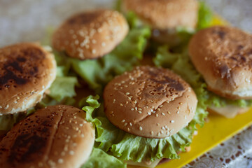 Many home-made burgers or cheeseburger on a table