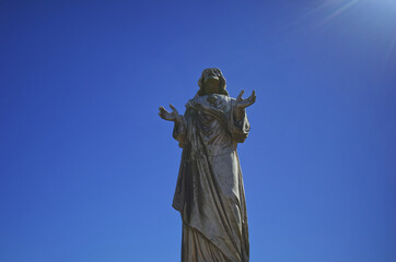 Old stone Jesus Christ statue catholic 