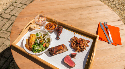 bbq food on wooden plate
