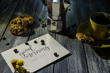Still life with cup of coffee and chocolate cakes on the grey background