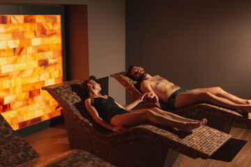 Couple relaxing in spa center salty room