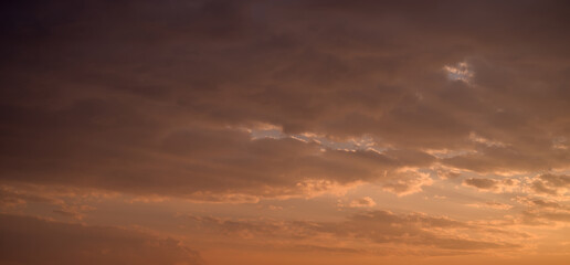 Beautiful colorful sky with clouds and sunlight. Color toned.