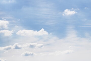 Light sky background. Clouds in the blue sky