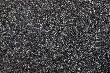 textural plaster of the house wall, colored granite chips, background