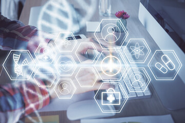 DNA hologram with businessman working on computer on background. Concept of bioengineering. Double...