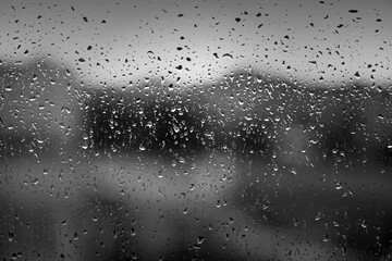 Water drops on window after heavy rain as texture or background