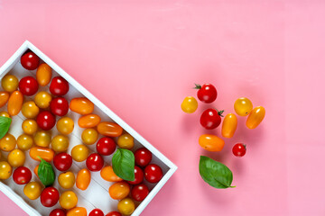 fresh italian cherry tomatoes on the vine in a wooden crate on a white background