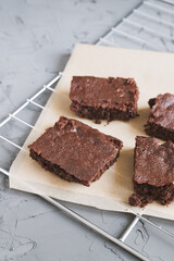 Homemade chocolate brownies served on a paper and tray. Fudgy Chocolate cake