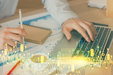 Double exposure of data internet theme hologram with man working on computer on background. Concept of innovation.