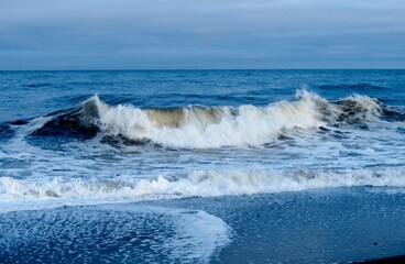 big foamy waves on the sea summer beach