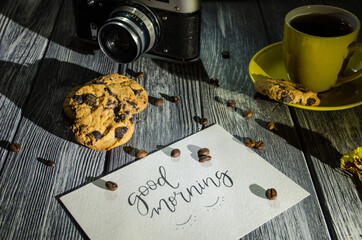 Still life with cup of coffee and chocolate cakes on the grey background