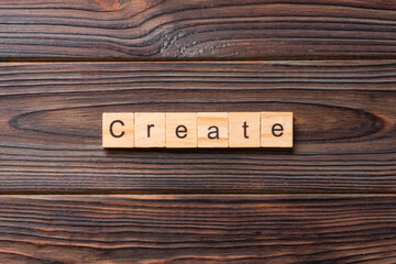 create word written on wood block. create text on table, concept