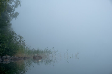 fishingnet in the water in a misty lake