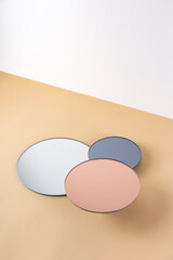 Podium, object stand on round mirrored surfaces in neutral tones. Mock up for product placement. Trend background