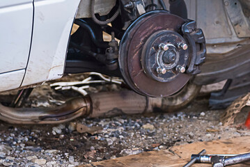 Closeup disc brake of the vehicle for repair.