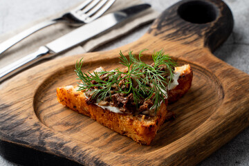 Italian snack: wheat bruschetta with cream cheese and forest mushrooms