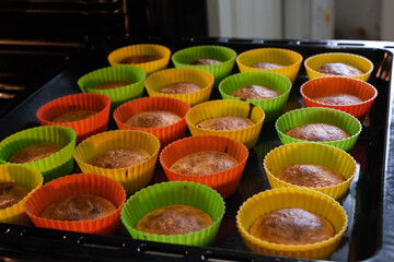 Baking cupcakes in the oven. Home cooking