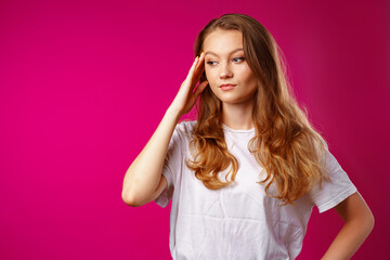 Fototapeta premium Young beautiful woman suffering from headache with hands on head