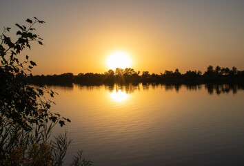 Obraz premium Beautiful sunset on the river.