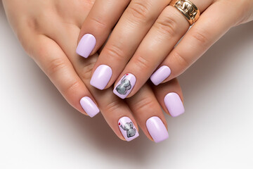 Gel nails. Close up of gray manicure with painted gray elephants and a red heart on short square nails on a white background.
