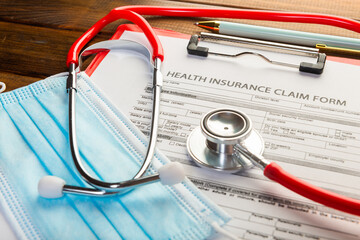 Health insurance claim form with surgical mask