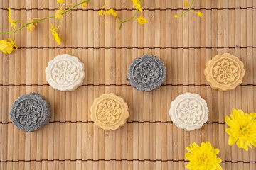 Colorful beautiful moon cake, mung bean cake, Champion Scholar Pastry cake for Mid-Autumn festival traditional gourmet dessert snack, top view, flat lay.