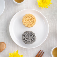 Colorful beautiful moon cake, mung bean cake, Champion Scholar Pastry cake for Mid-Autumn festival traditional gourmet dessert snack, top view, flat lay.
